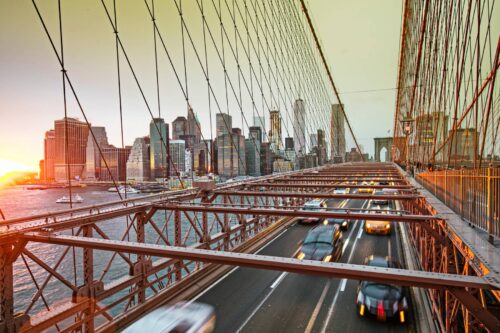 NY bridge with traffic and city backdrop