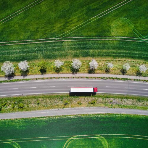 aerial view of roadway and grassy fields