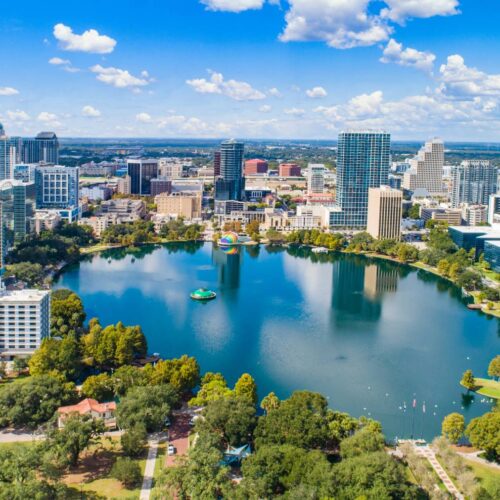 city with a lake and greenery