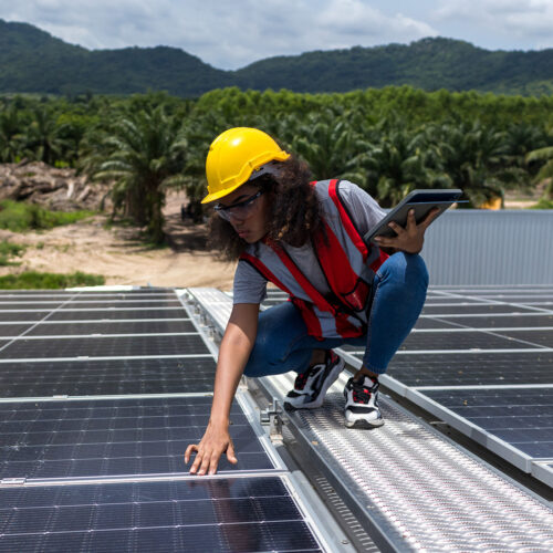female engineer working on solar panels