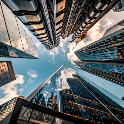 Looking directly up at the skyline of the financial district in central London