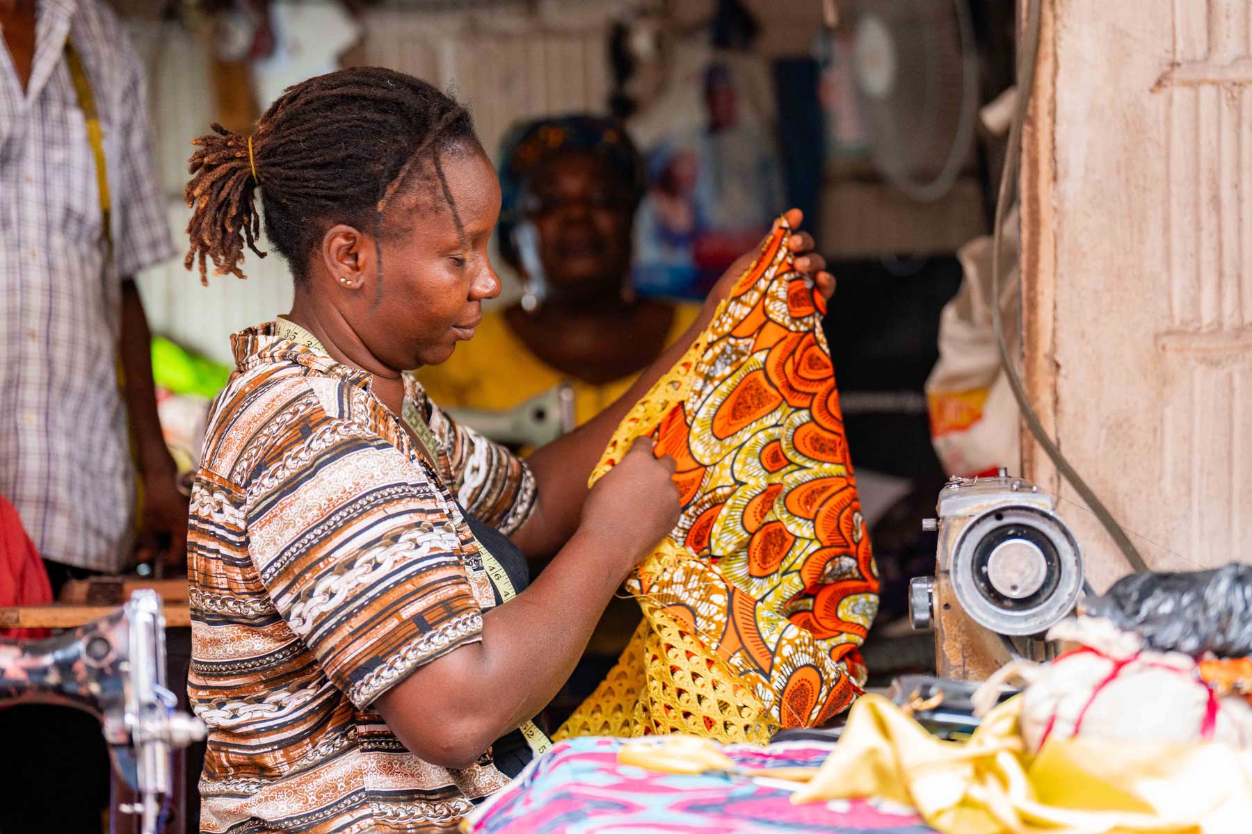 Mary Alaele Baelanki at her seamstress stall in Wuse market
