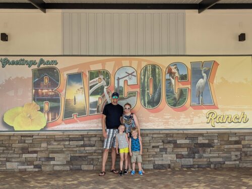 Ryan Foelske and his family beside the Babcock Ranch sign
