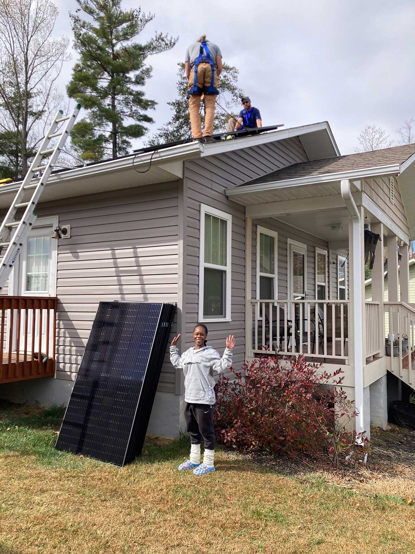 Shaketia Simpson excited about the solar panels being installed on her roof in Asheville, North Carolina Photo courtesy Sugar Hollow Solar