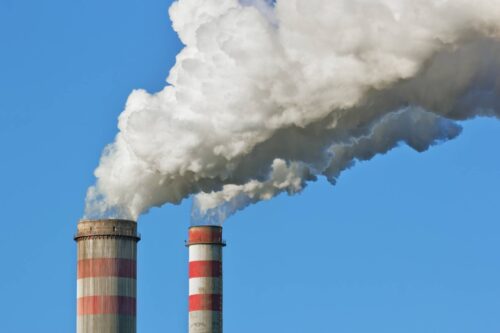 smoke stacks releasing gas