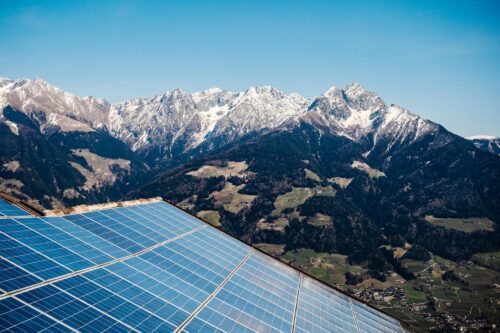 solar panels with mountains in the background