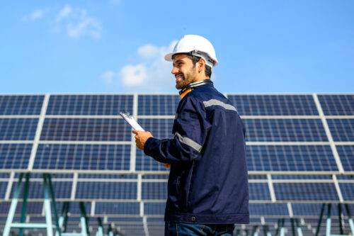 technician working on solar panel array