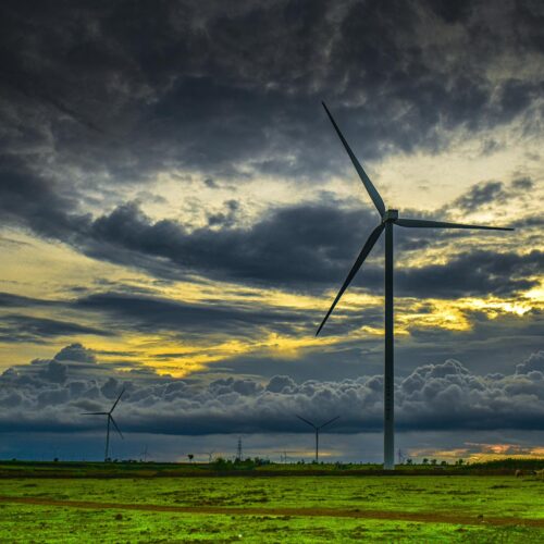 windmill at sunset with heavy clouds