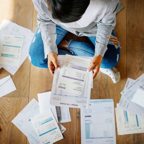 woman with piles of paper