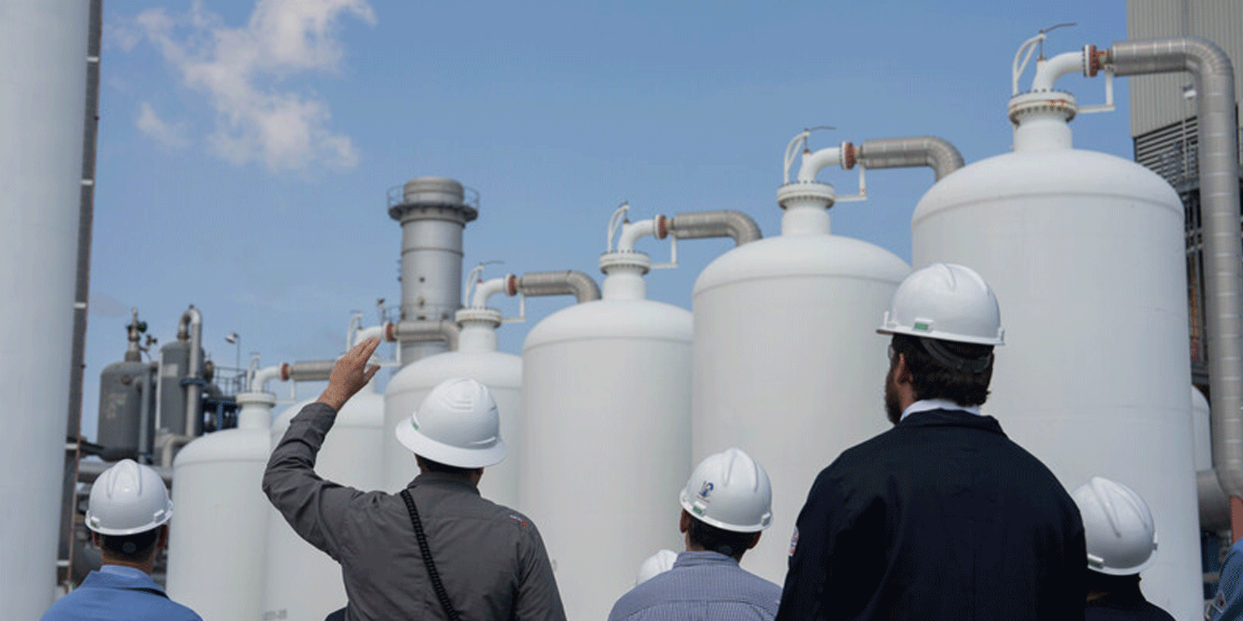 People in hardhats visit the Air Liquide hydrogen facility in Houston, Texas